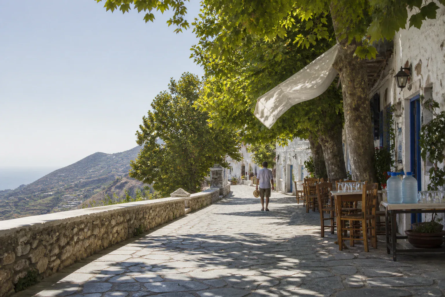 Editorial concept of a naturally shaded high Greek village