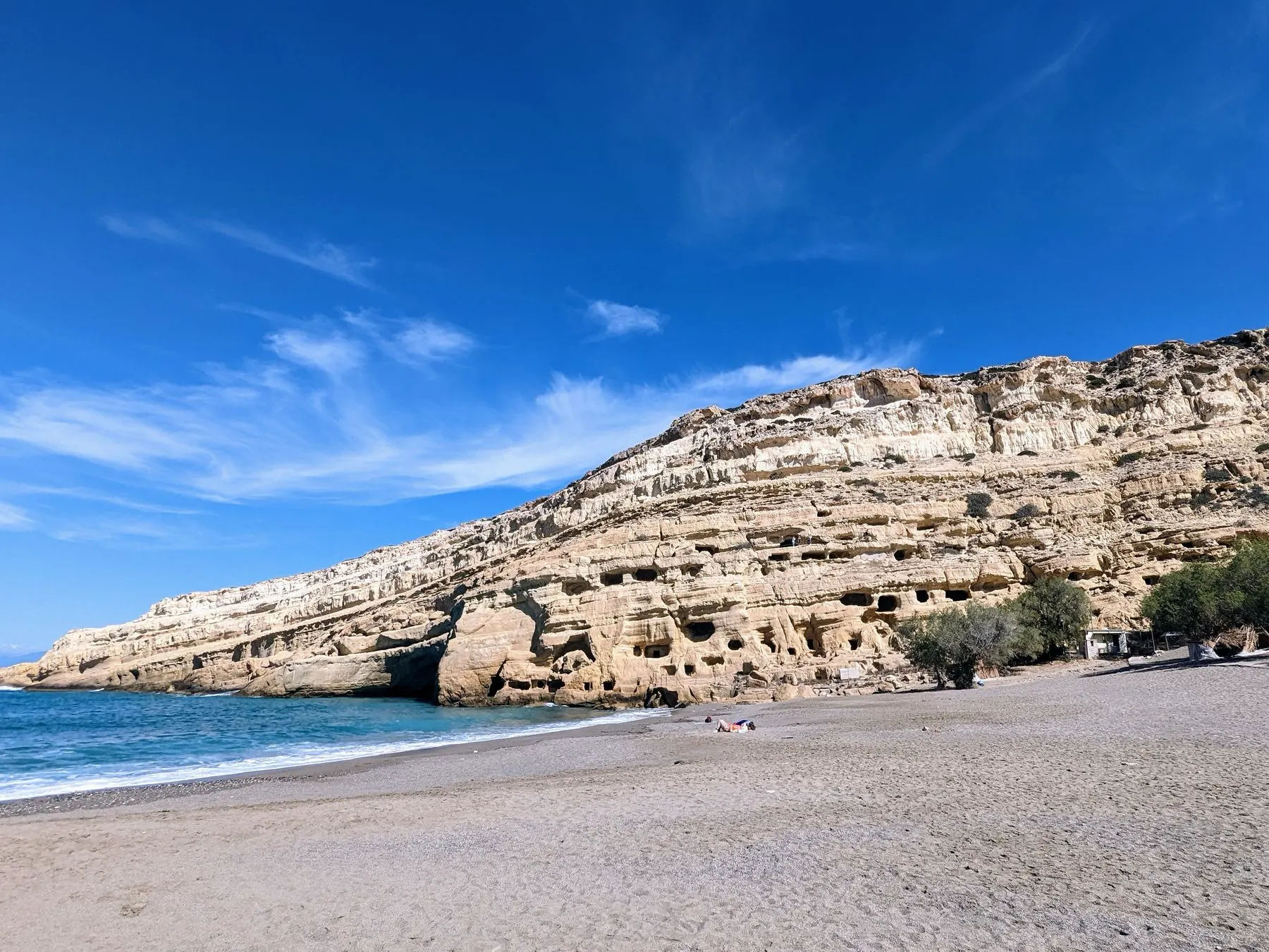 The cave-carved cliff above the beach at Matala