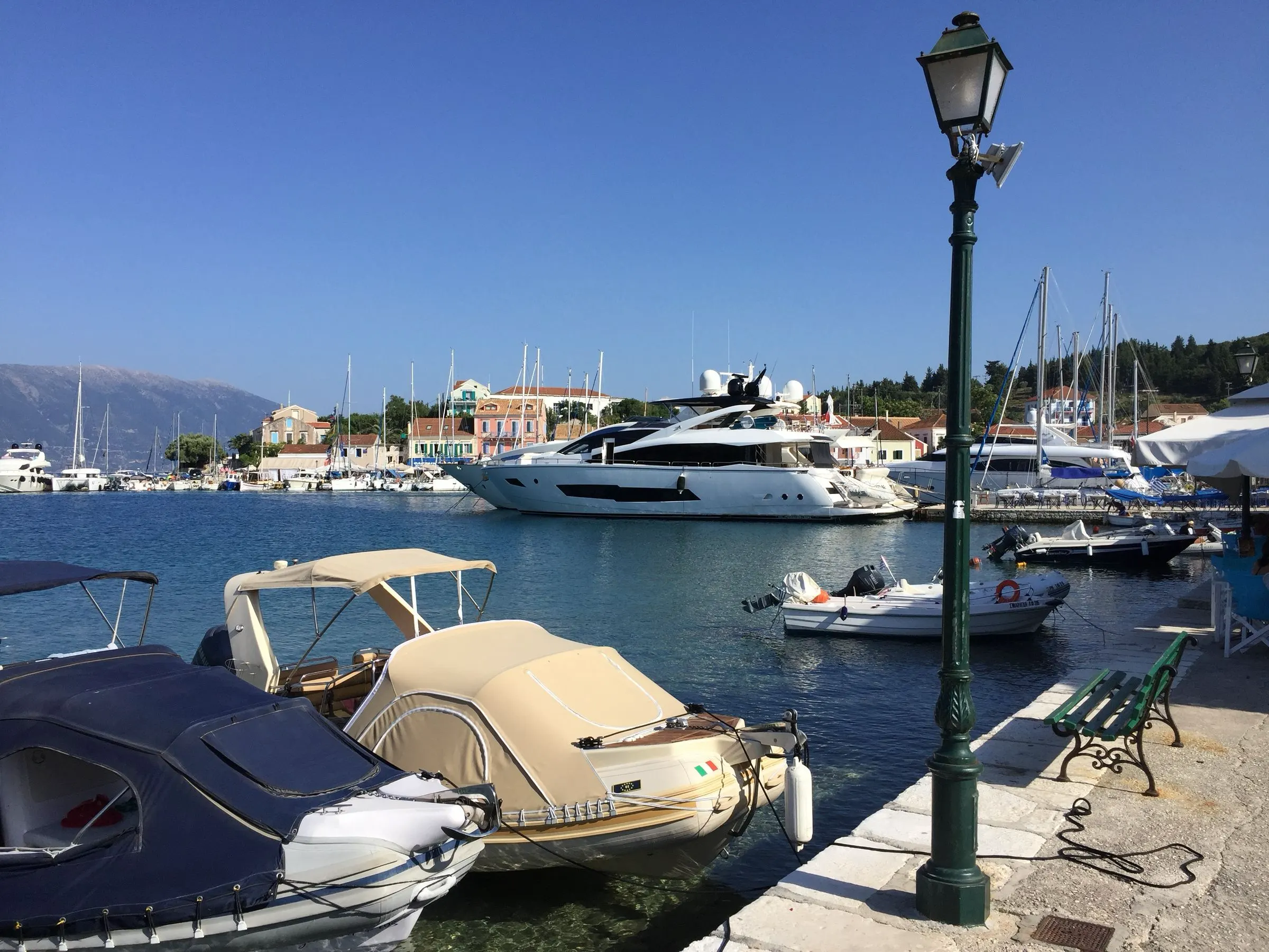 Pastel Venetian-era houses around the harbour at Fiskardo