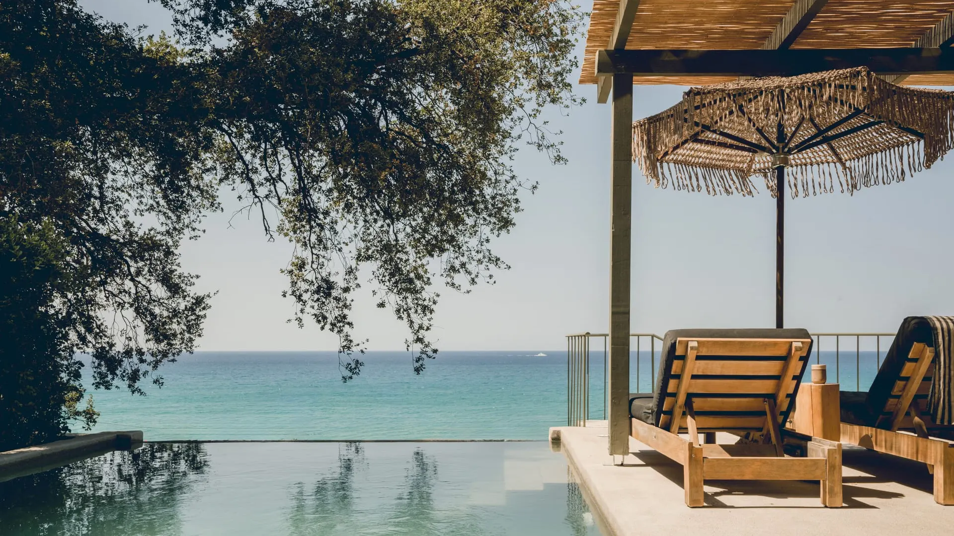 A hillside villa terrace above a turquoise bay on Kefalonia