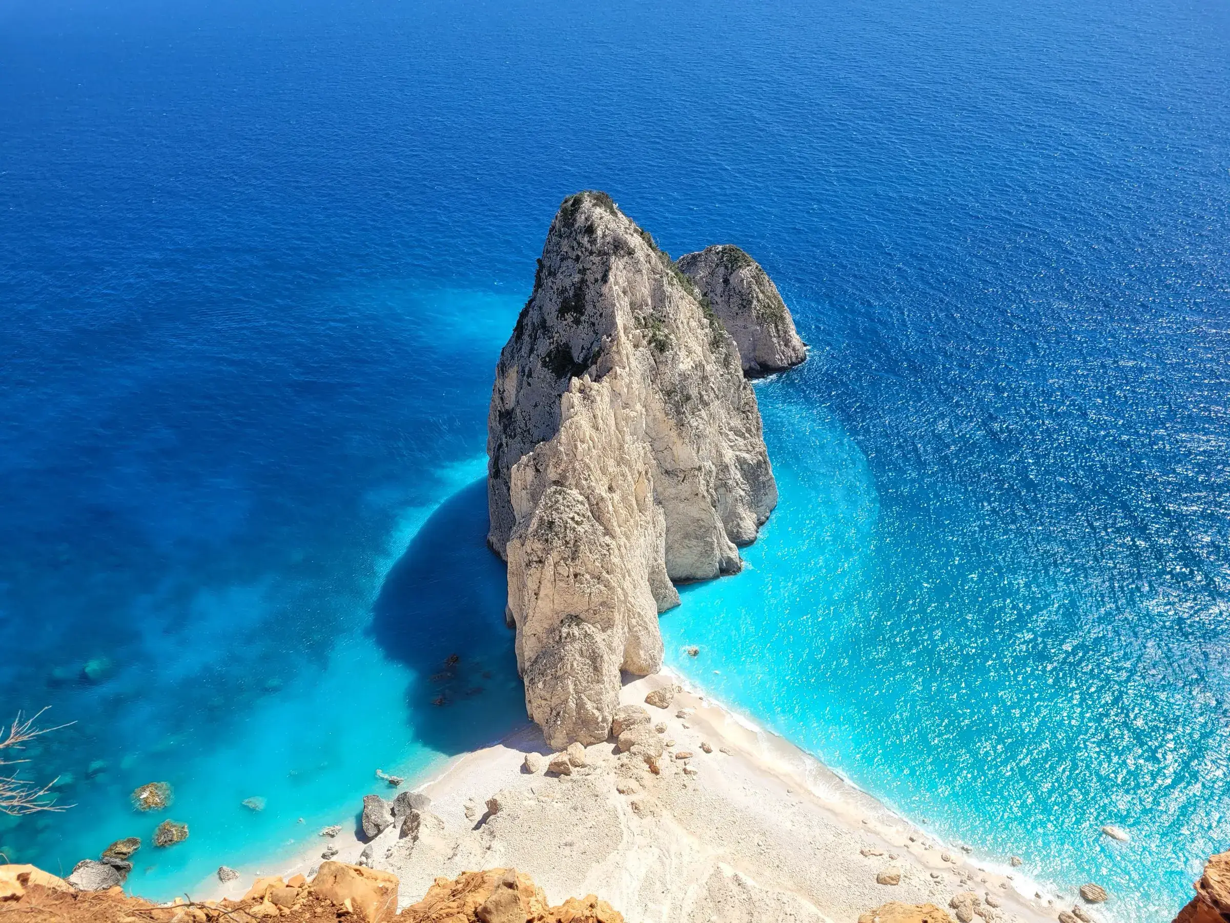 The white Mizithres sea stacks below the Keri cliffs on the west coast of Zakynthos