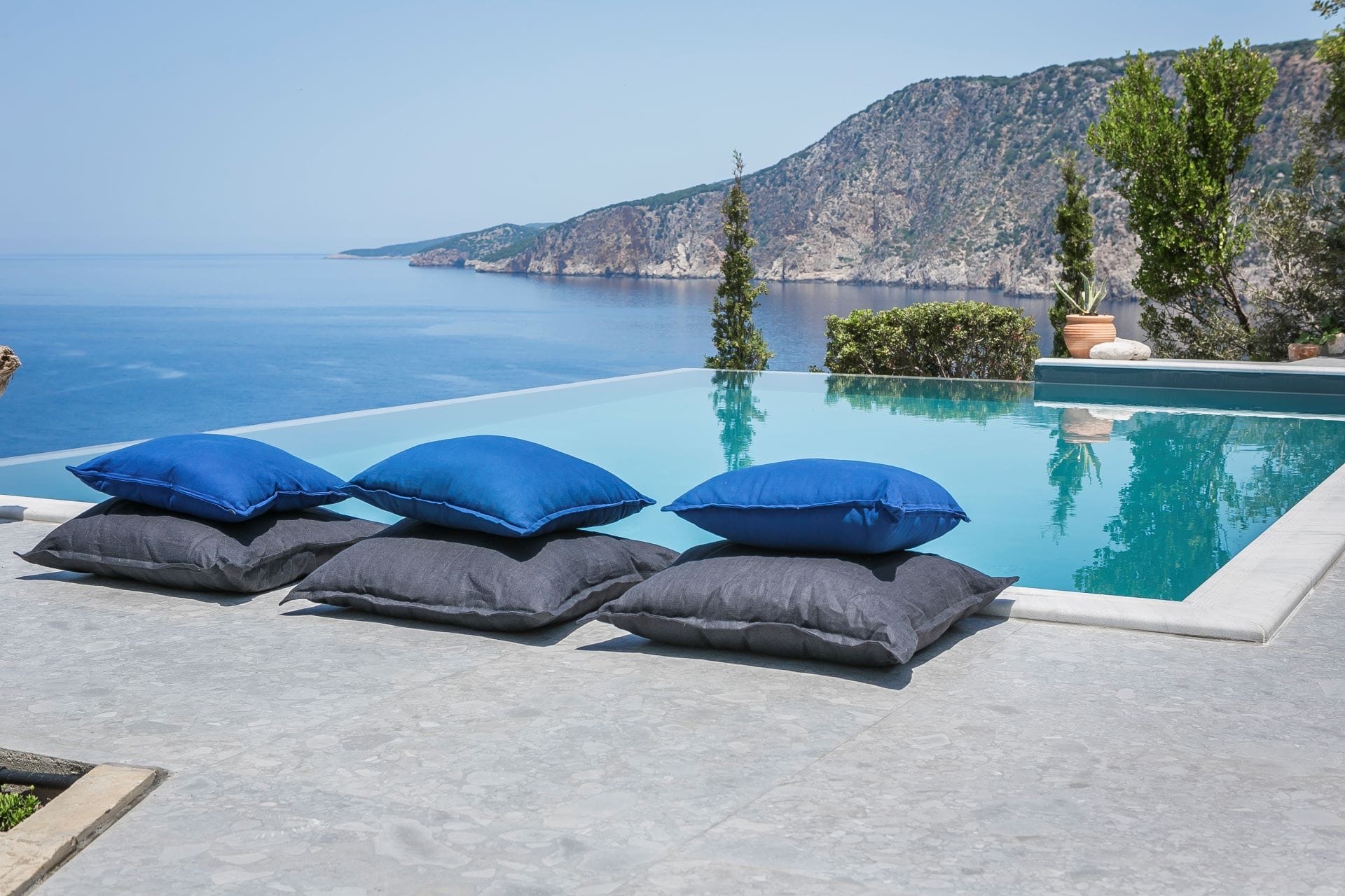 Infinity pool at Villa Eleni facing the cliffs of the Kefalonian coast