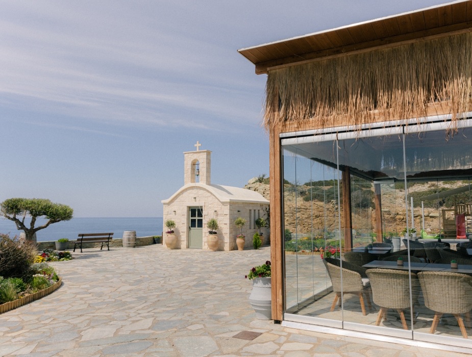 Rock Bay Villas taverna and chapel square overlooking the sea