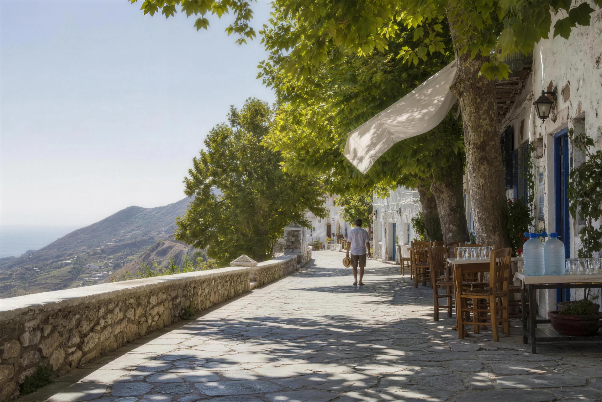 Editorial concept of a naturally shaded high Greek village