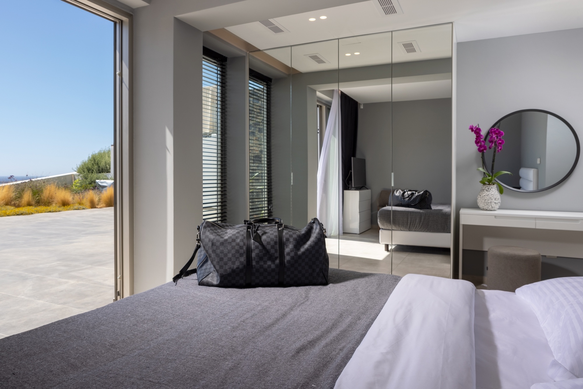 Villa Lyra bedroom opening onto its sea-facing terrace