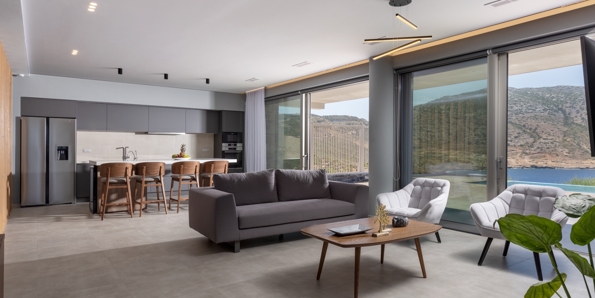 Villa Lyra open-plan living room and kitchen with bay views