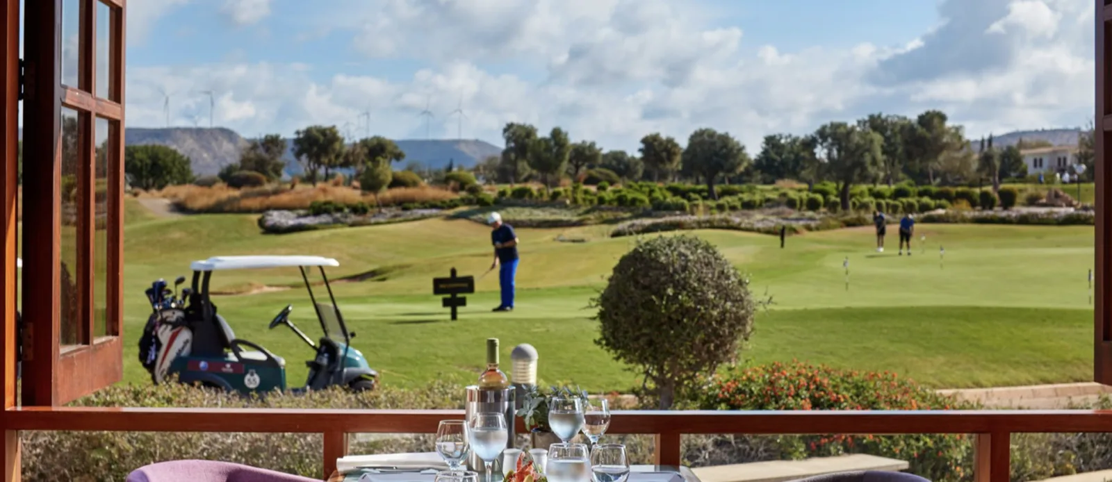Golf buggy beside the fairway at the Aphrodite Hills course