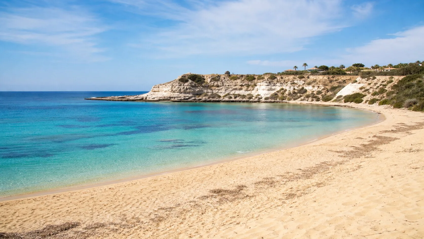 Coral Bay near Paphos with golden sand and calm turquoise water