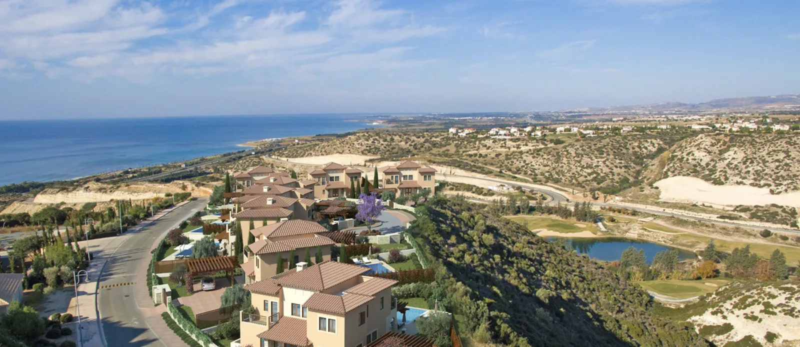 Aerial view of the Aphrodite Hills resort spread along the Cyprus coastline