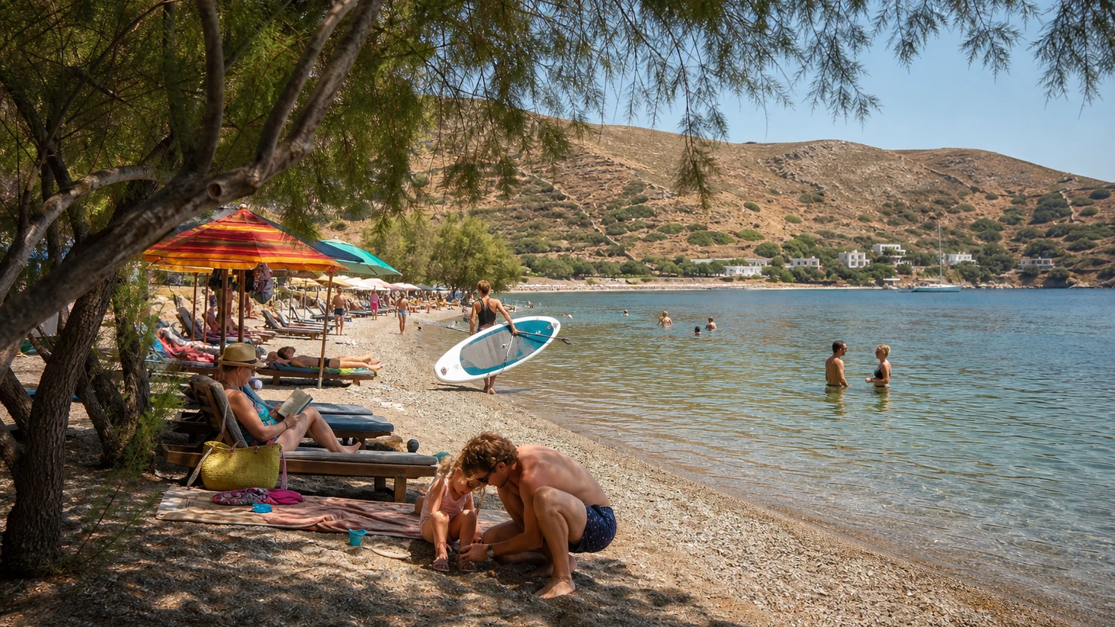Families and swimmers spending a high-summer afternoon at Kambos beach in Patmos