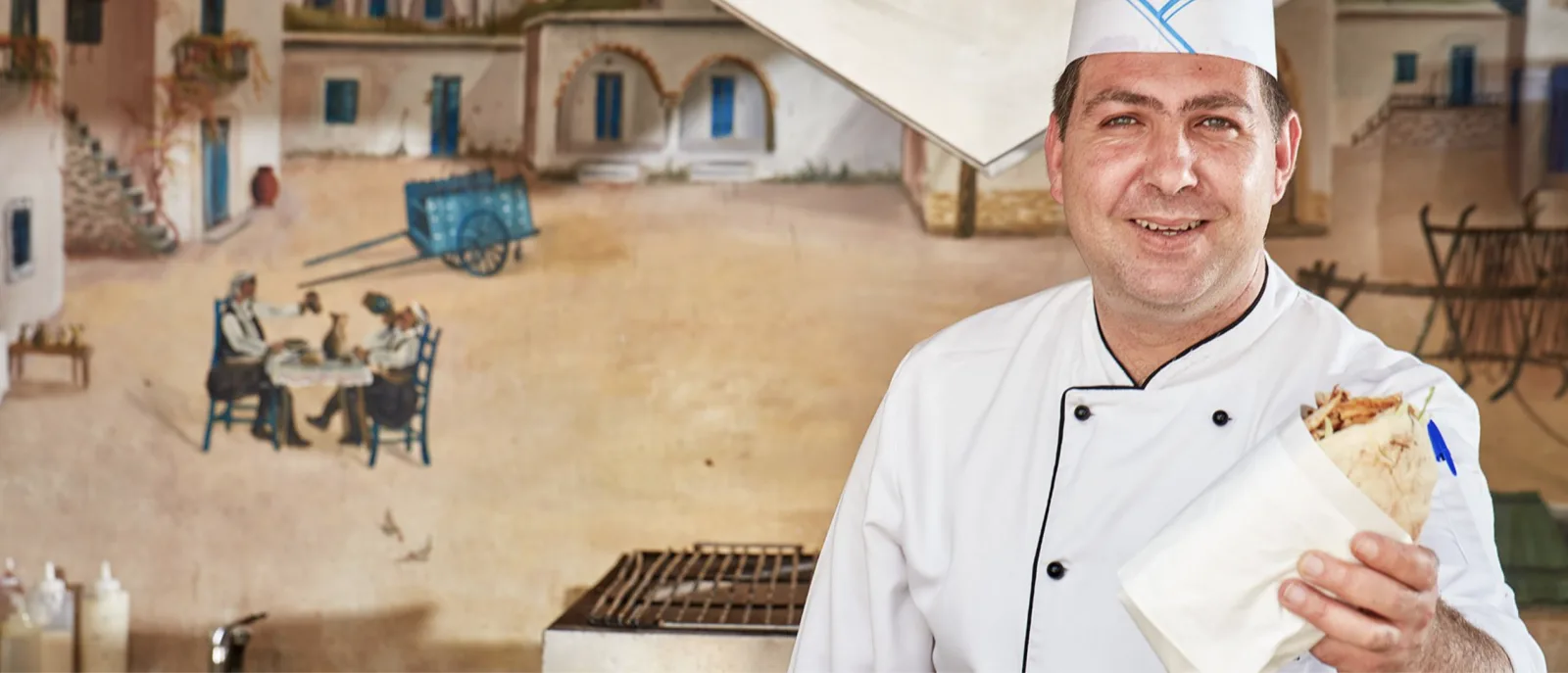 Chef preparing a private dinner for guests at an Aphrodite Hills villa