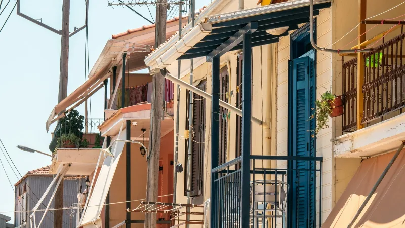 Colourful houses with blue shutters and balconies in Lefkada Town